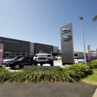 Plantability Landscaping Lush Green way around Car Dealership