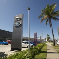 Plantability Landscaping Lush Green way around Car Dealership